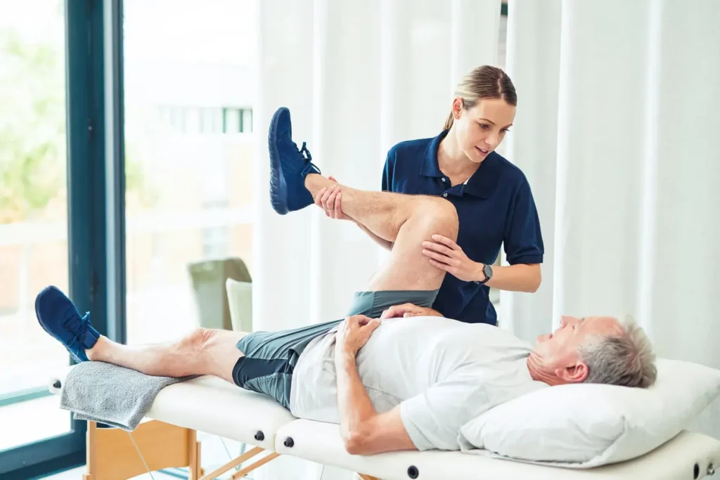 Revitalising Recovery: Effective Rehabilitation Strategies for Muscle Injuries 3 Physiotherapist assisting a patient with muscle recovery exercises Belper