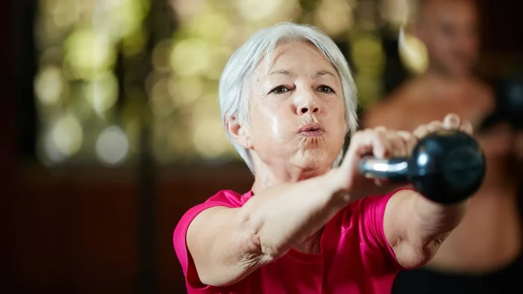 Toning Bingo Wings: Effective Exercises and Tips for Achieving Sleeker Arms 2 Person performing arm exercises with dumbbells Belper