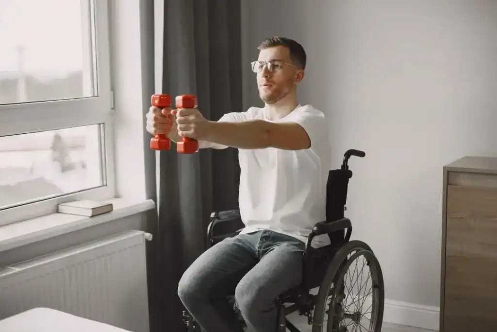 Image of man doing exercise in his wheelchair to aid weight loss Belper