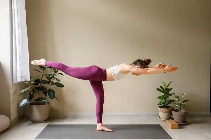 Woman doing Yoga exercise Belper to help with toning the body. 